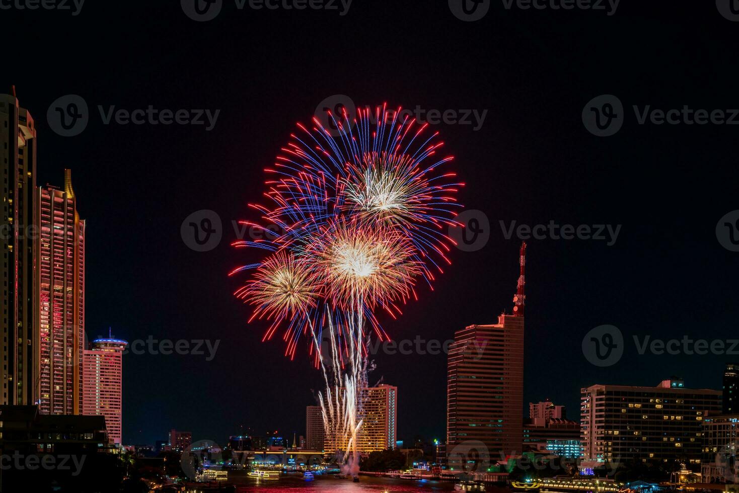 fireworks on the river in the dark sky photo