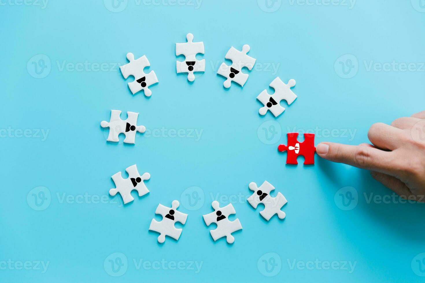 Human resources management and recruitment business build team concept. Image of tangram puzzle blocks with people icons over wooden table ,human resources and management concept. photo