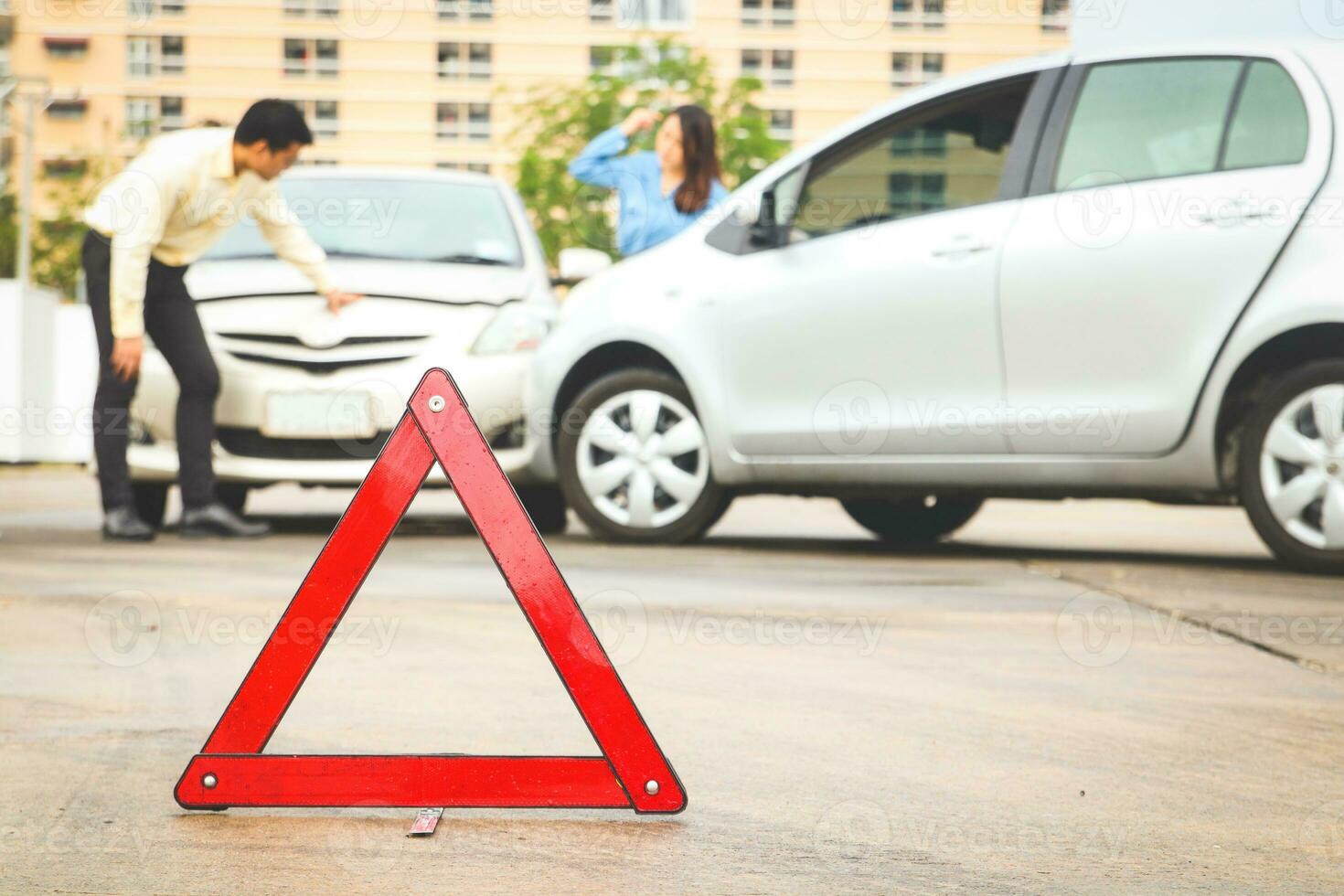 The concept of car insurance. car accident on road An emergency reflective triangular sign is placed at the front to help reduce road accidents. photo
