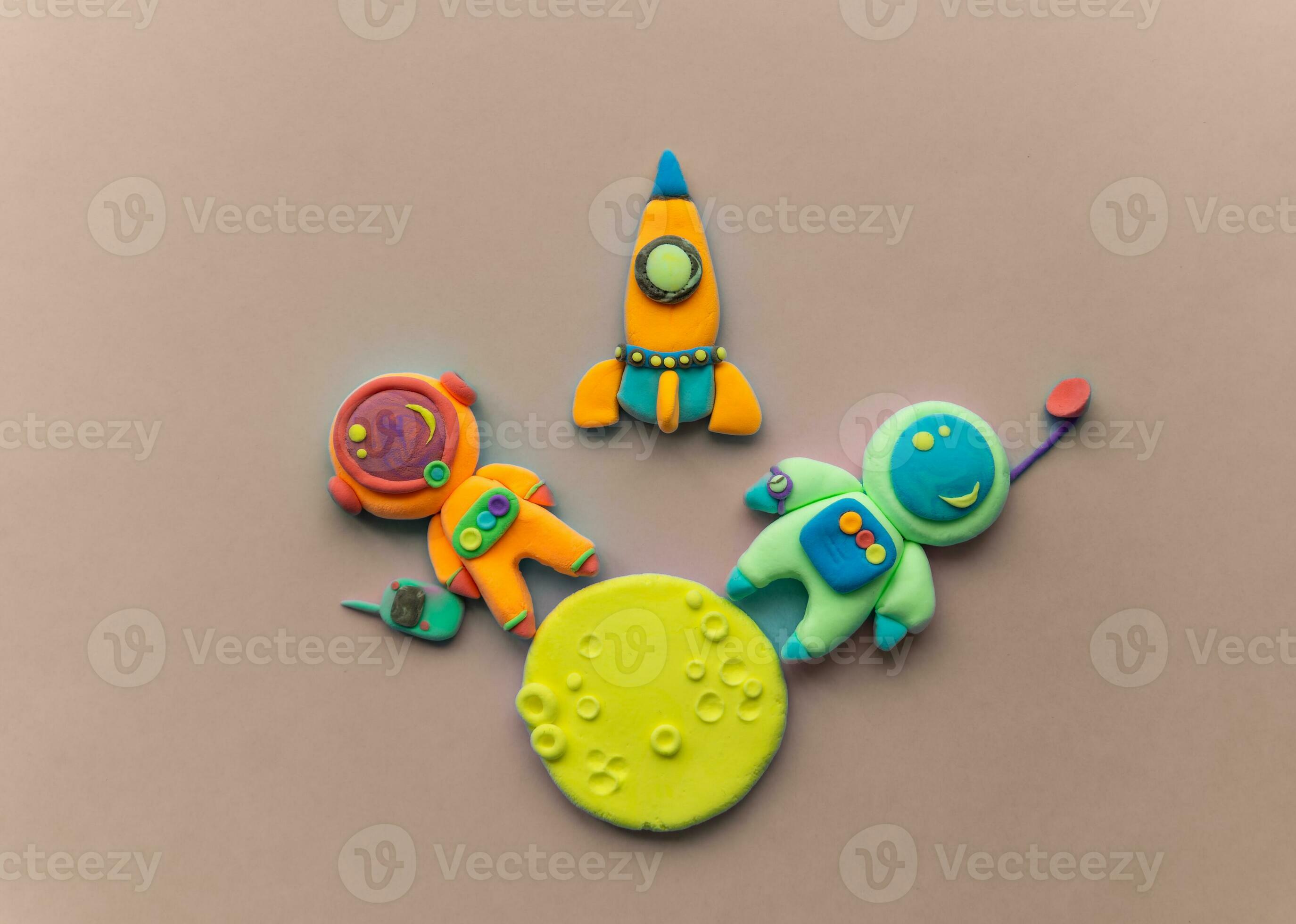Astronauts On The Moon. Astronaut Is Made Out Of Play Clay. Spaceship