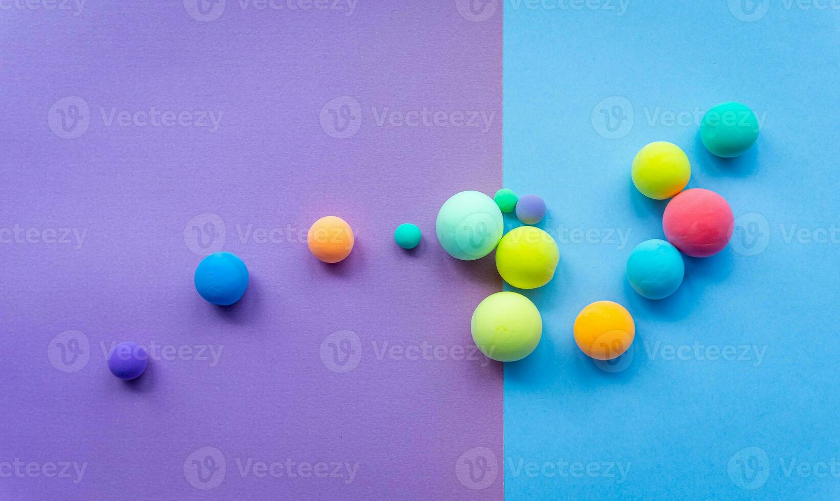 Colorful abstract figures made of plasticine, Balls of different sizes. Funny illustration for the background of children's holidays, frame for text photo