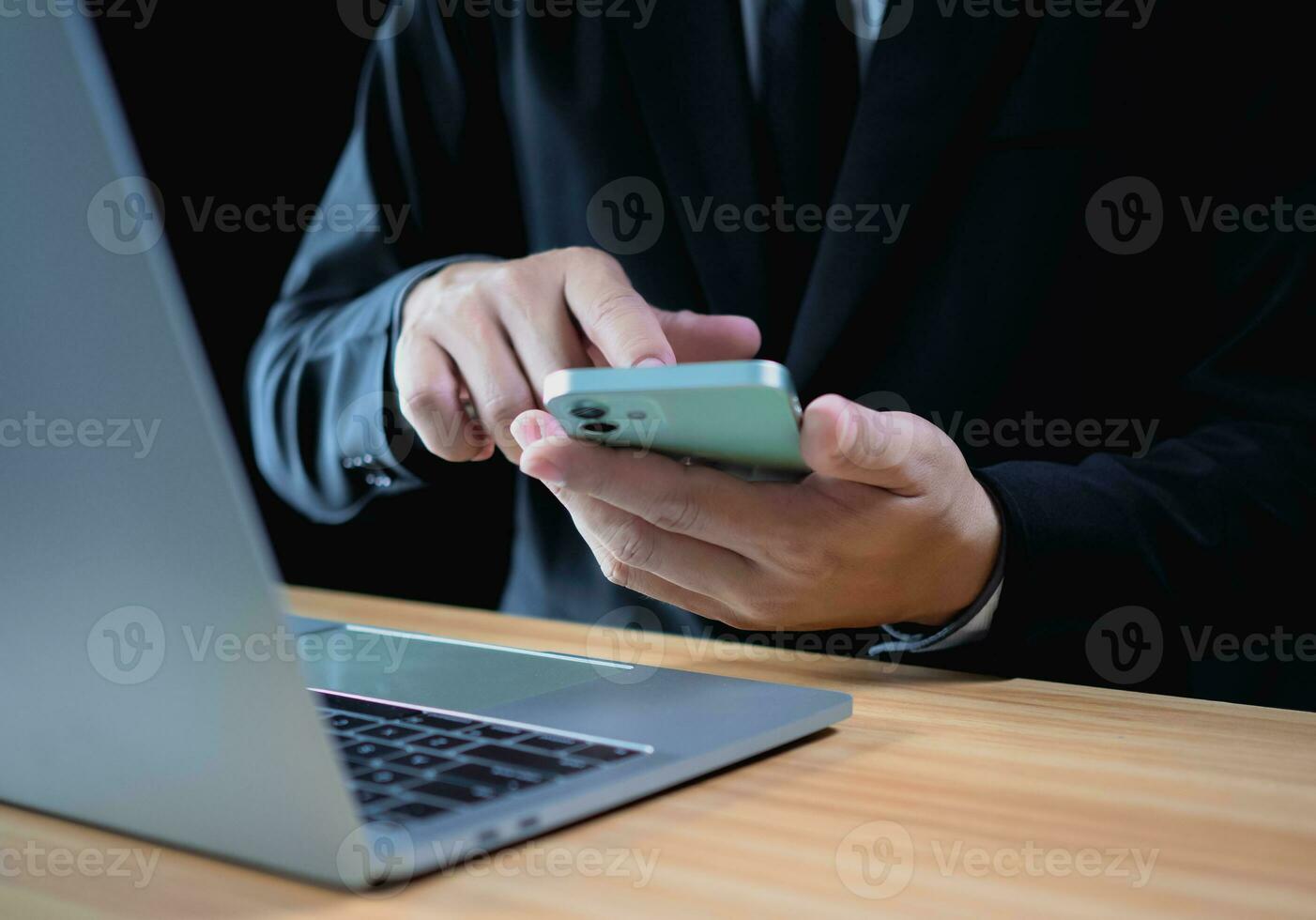 Businessman using phone and computer for work. Business concept. communication concept photo