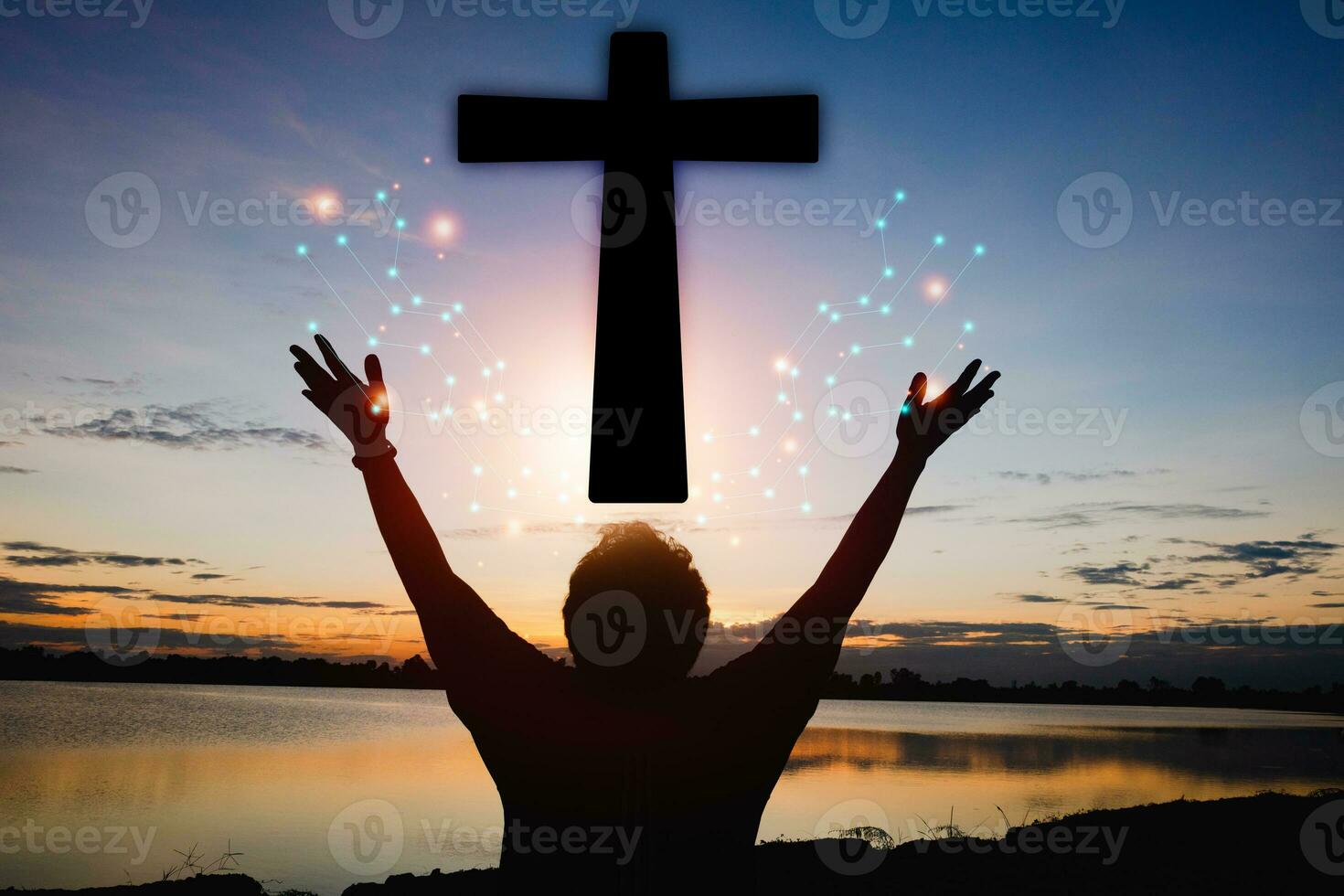 A man raises her hands and cross  with sunset.She is so calm hope,respect,spiritual , crucifix,religion and peace.Photo Christian and hope concept idea. photo