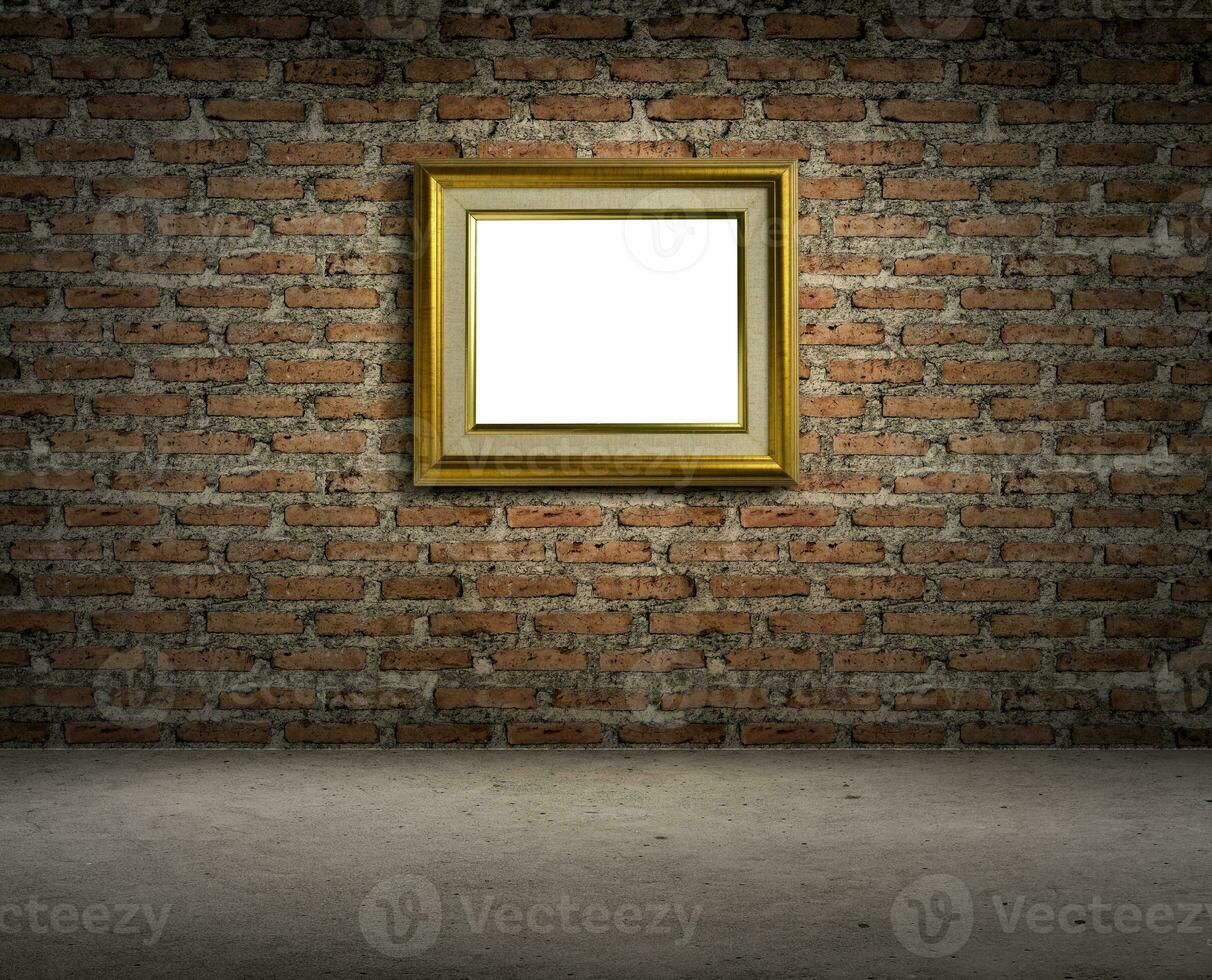 Golden picture frame on dark brick wall photo