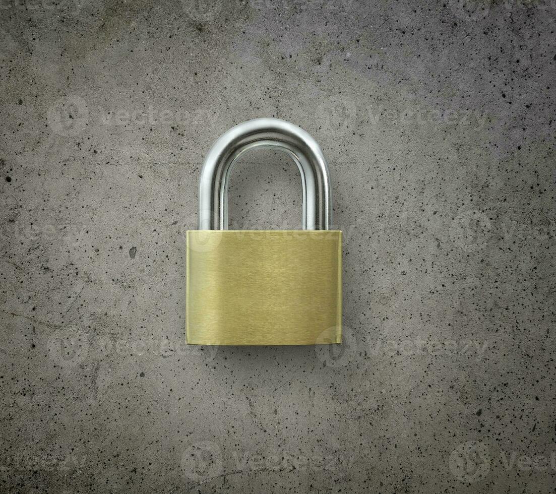 Locked Silver Padlock on cement background photo