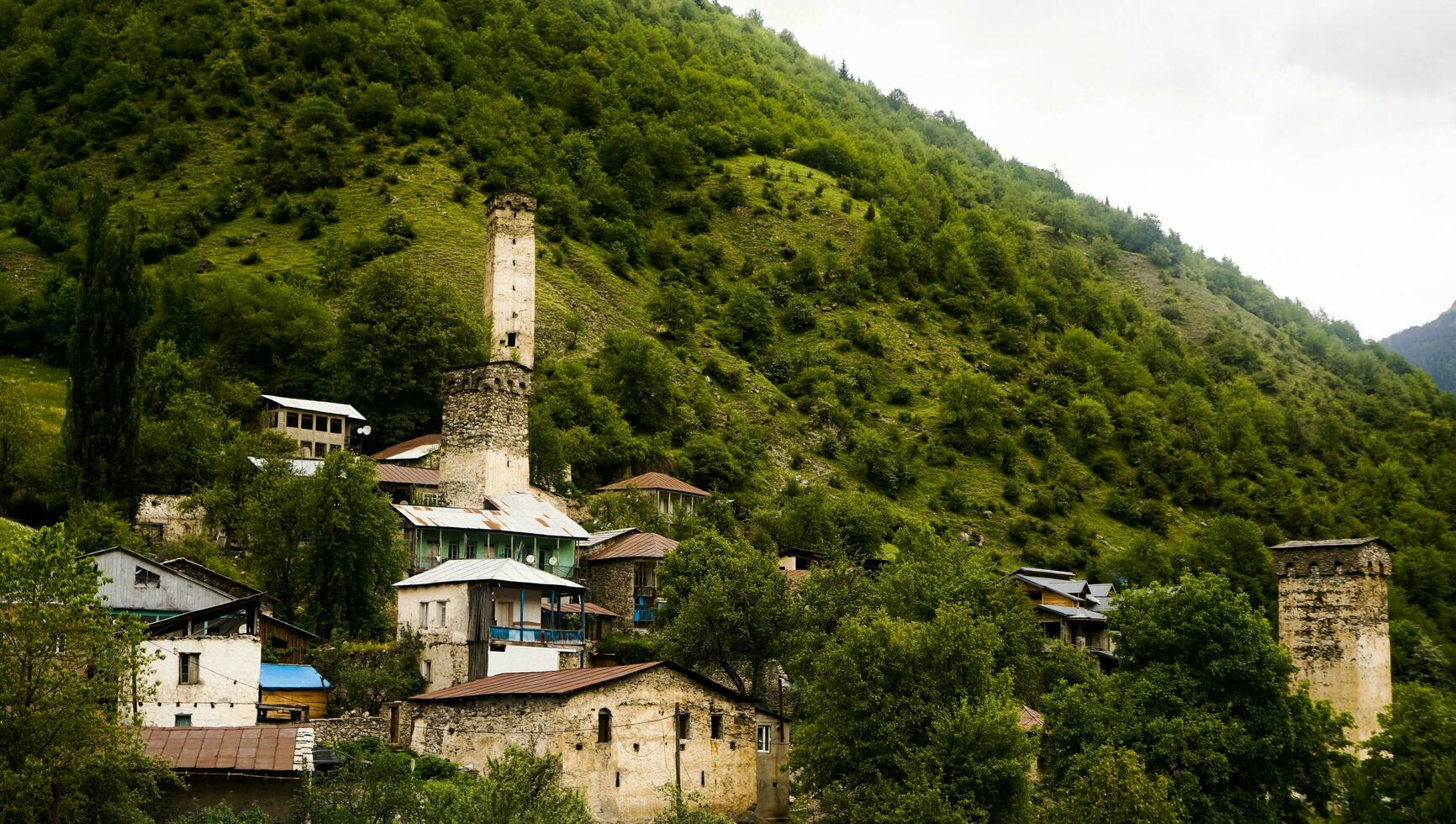 Svaneti. Svan towers in Mestia Svaneti region of Georgia. Ancient stony towers photo