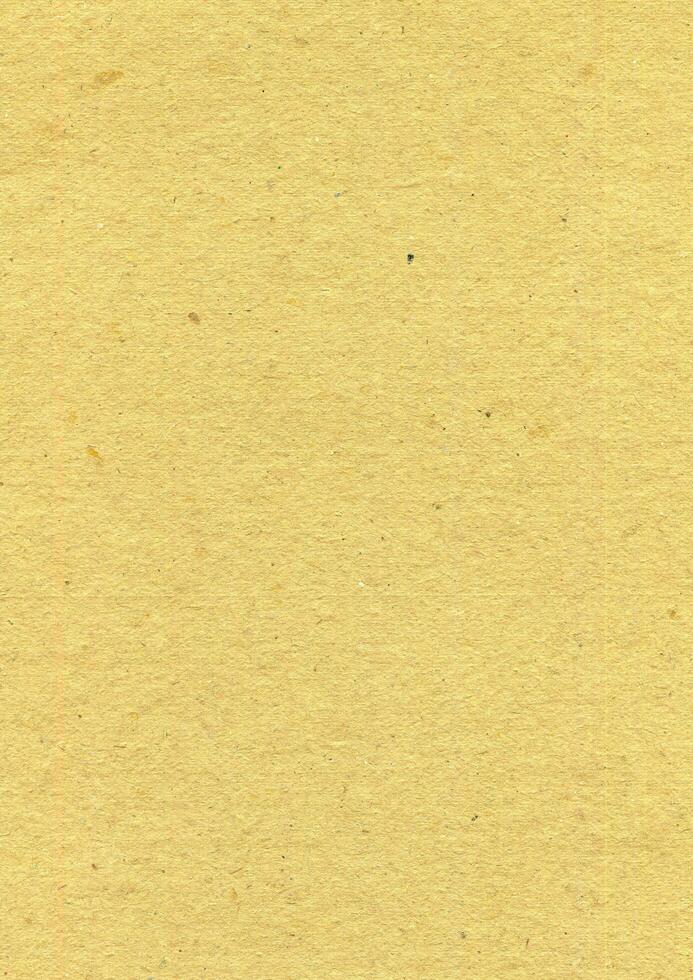 Yellow paper with grainy texture photo background. Old paper surface backdrop.