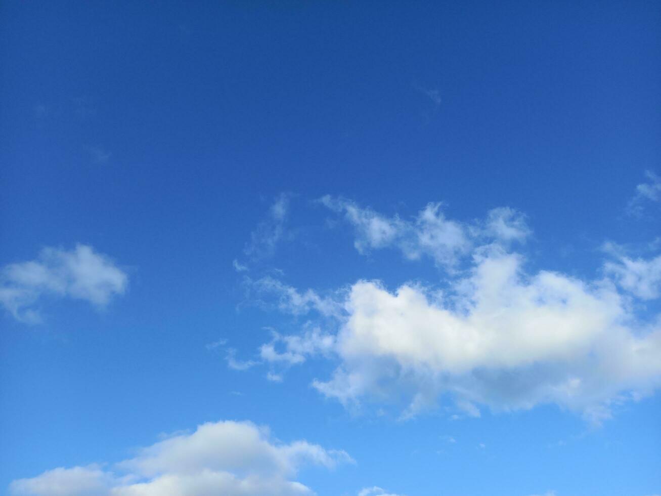 Bright blue sky with white cloud photo. Clear summer sky backdrop design for background. photo