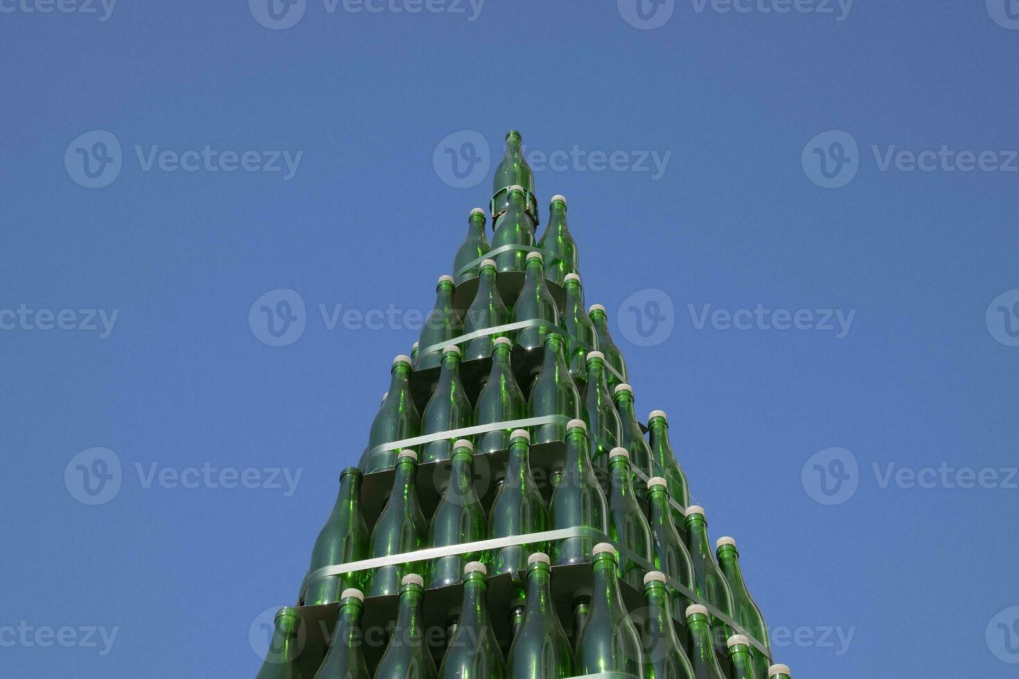 Christmas tree of bottles of champagne. Creative from bottles. Empty bottles of champagne photo