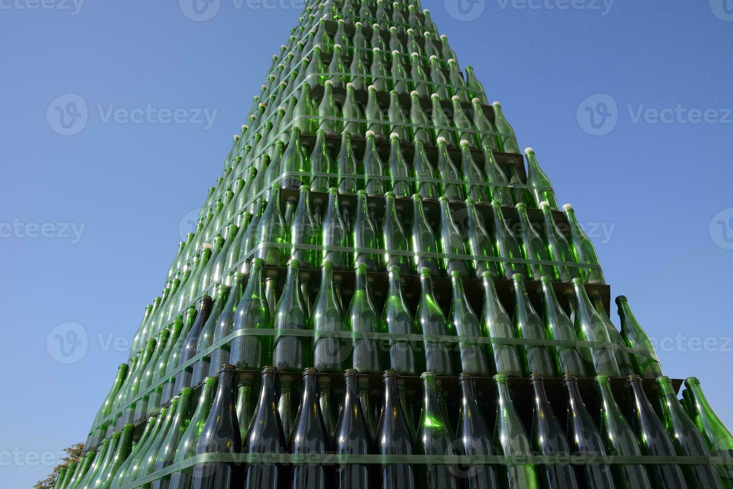 Christmas tree of bottles of champagne. Creative from bottles. Empty bottles of champagne photo