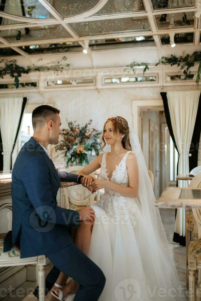 bride and groom inside a cocktail bar photo