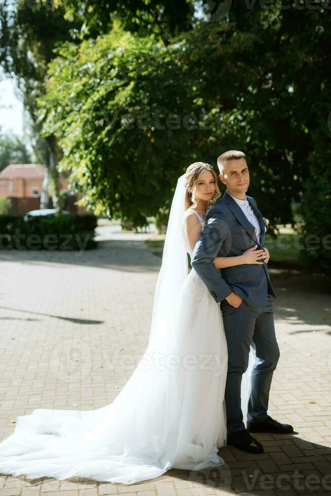 newlyweds walk in the city near old buildings photo