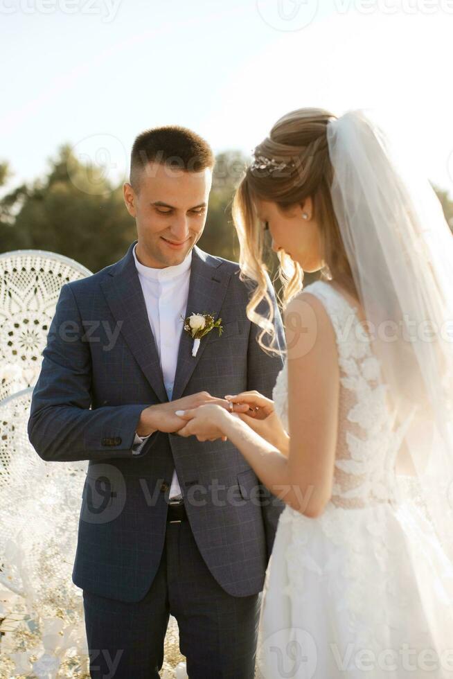 wedding ceremony of the newlyweds on the pier photo