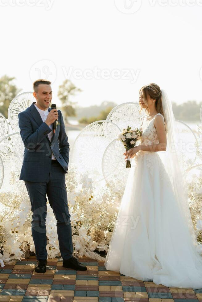 wedding ceremony of the newlyweds on the pier photo
