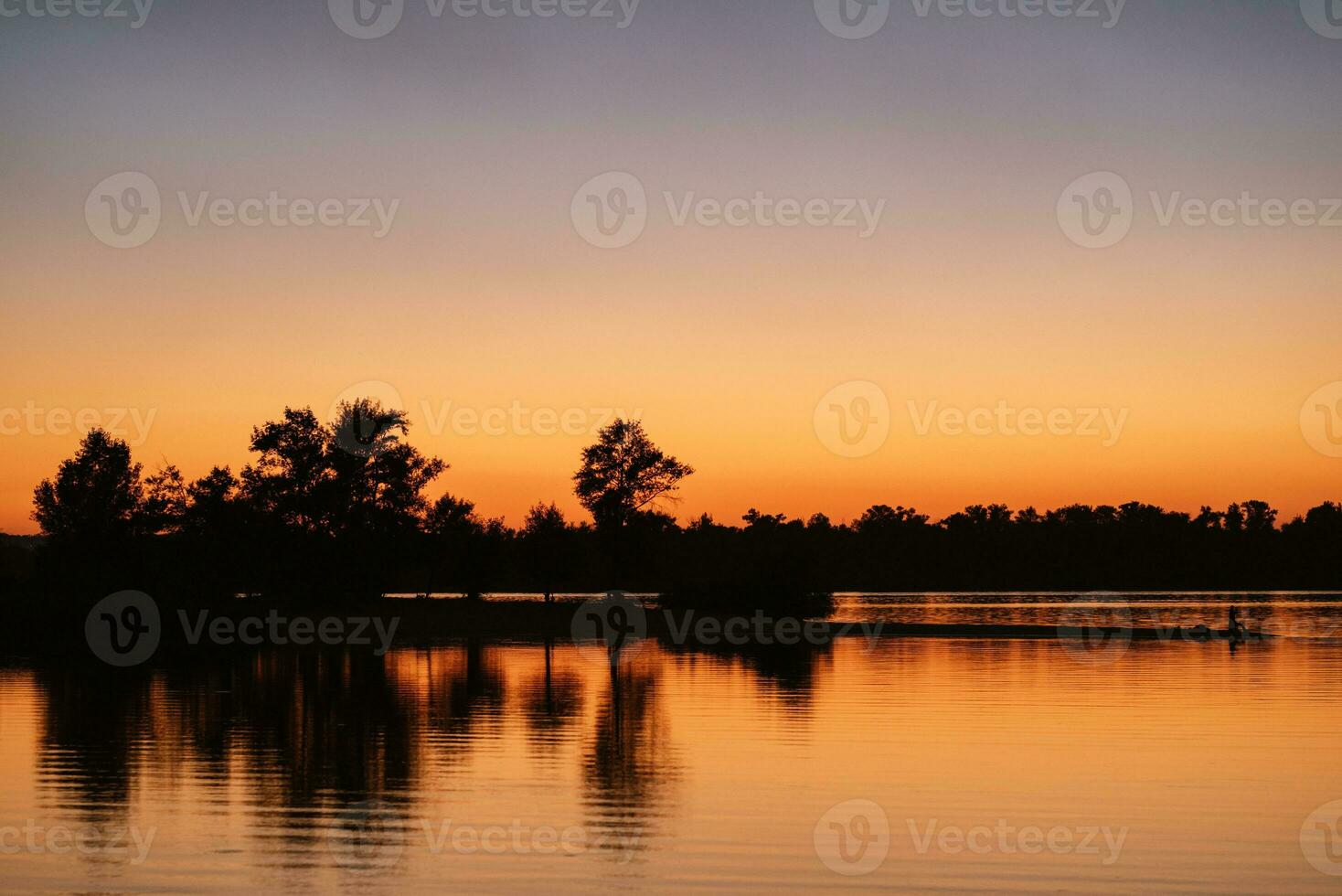 river in the orange sunset light photo