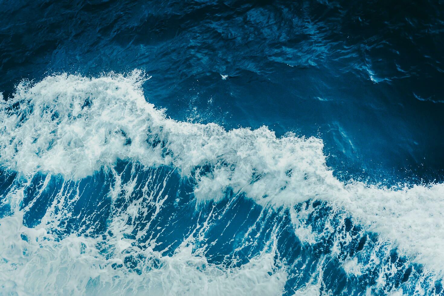 View from above turquoise ocean waves background. photo