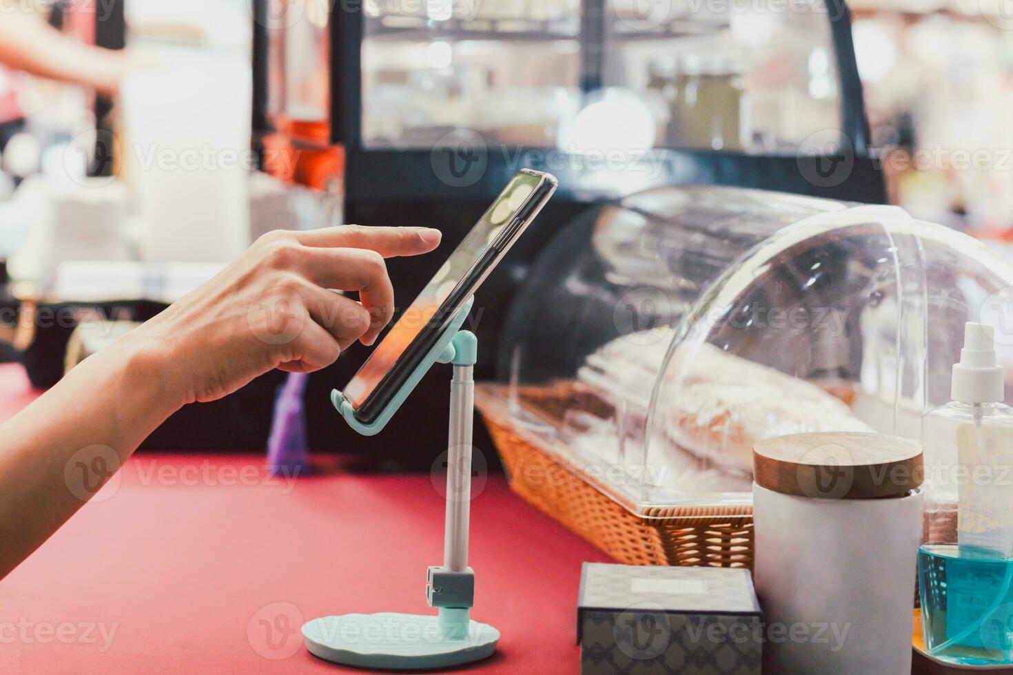 Small business owner using mobile phone checking commercial online order. photo