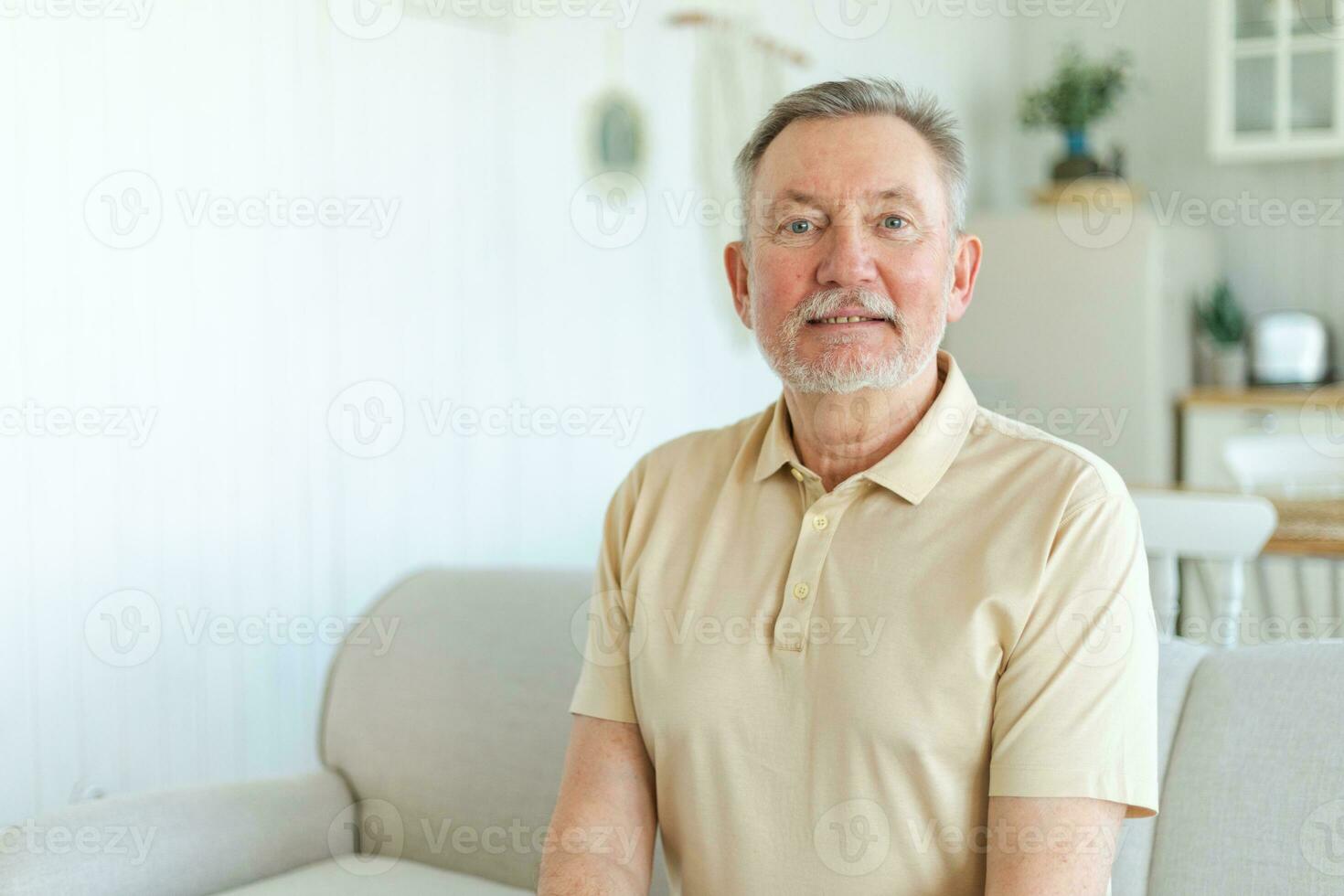 Confident stylish middle aged senior man at home. Older mature 70s man smiling. Happy attractive senior beard grandfather looking camera close up face headshot portrait. Happy people. photo