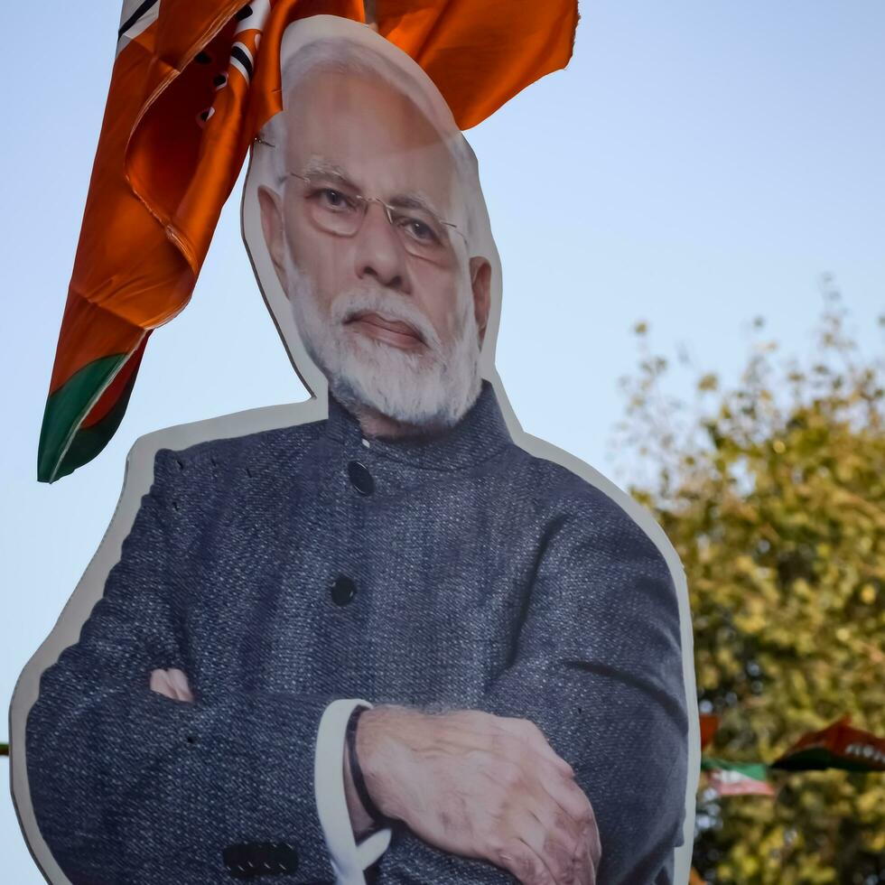 New Delhi, India - January 16 2023 - Prime Minister Narendra Modi cut out during BJP road show, the statue of PM Modi while attending a big election rally in the capital photo