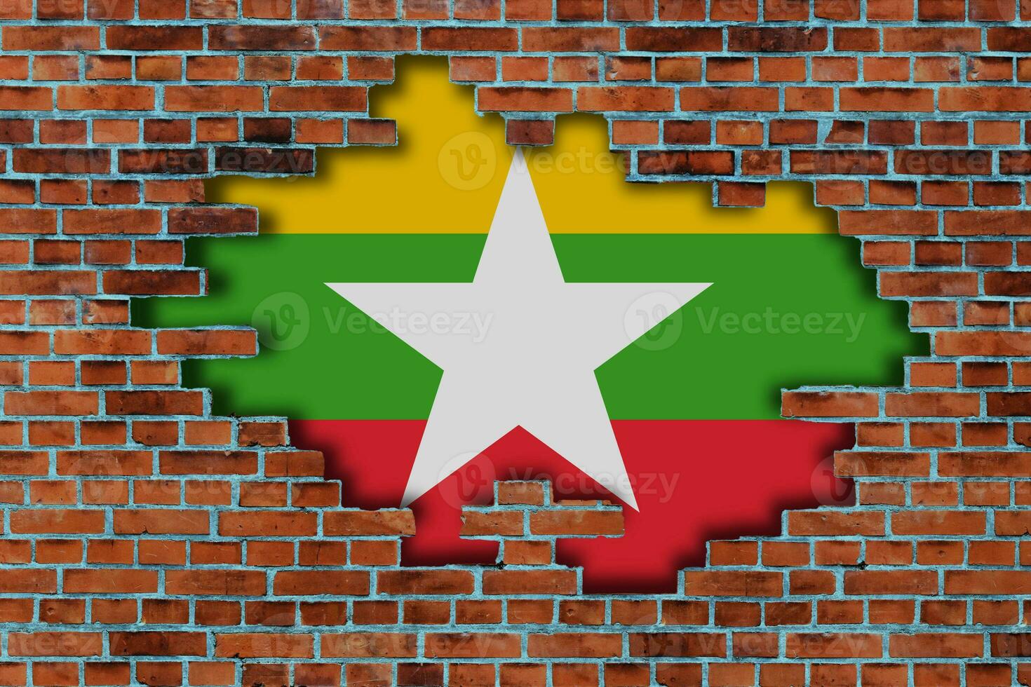 3D Flag of Myanmar behind the broken old stone wall background. photo