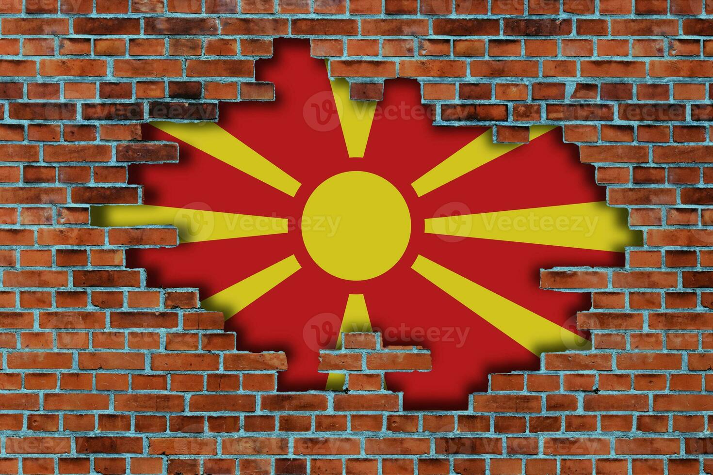 3D Flag of North Macedonia behind the broken old stone wall background. photo