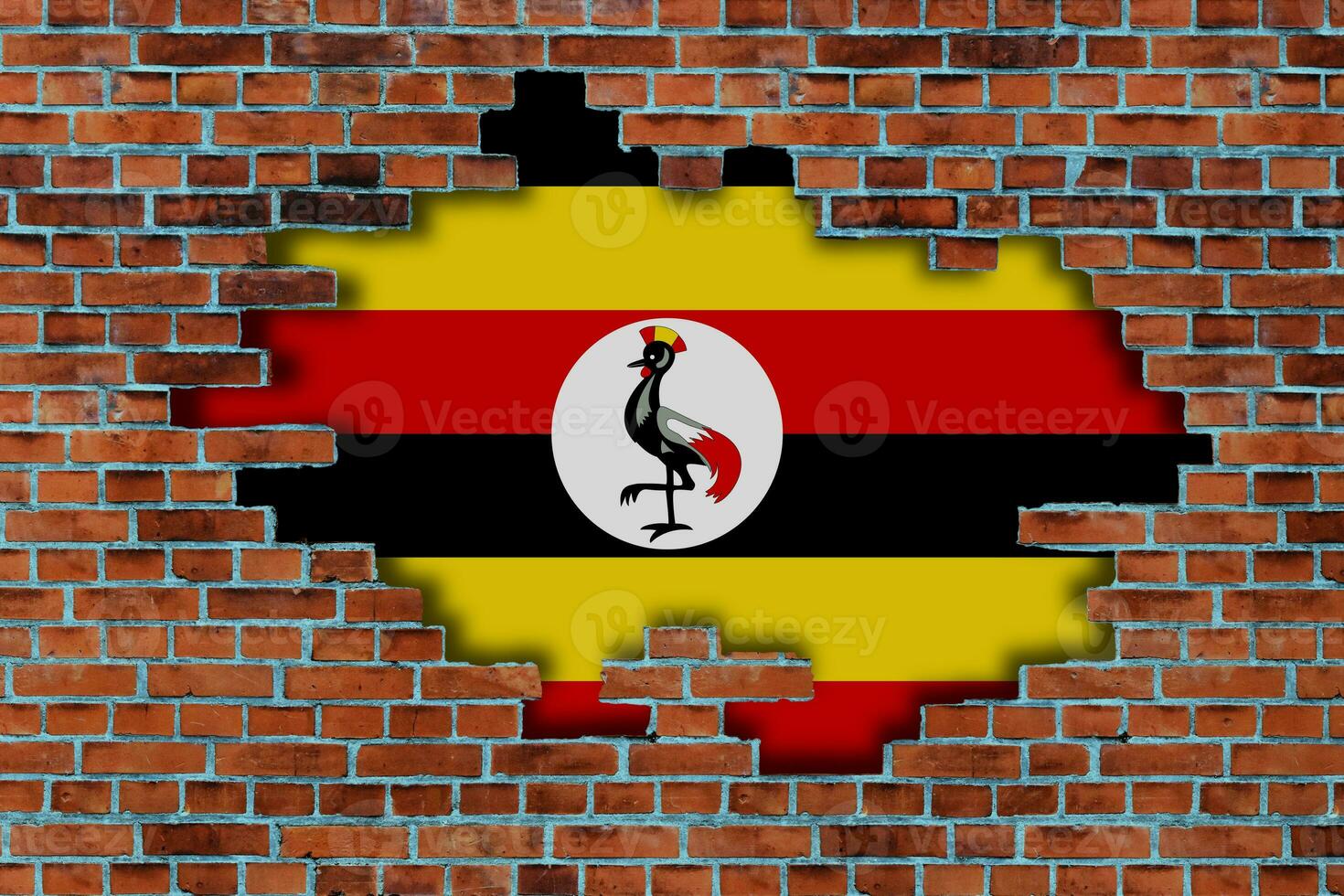 3D Flag of Uganda behind the broken old stone wall background. photo