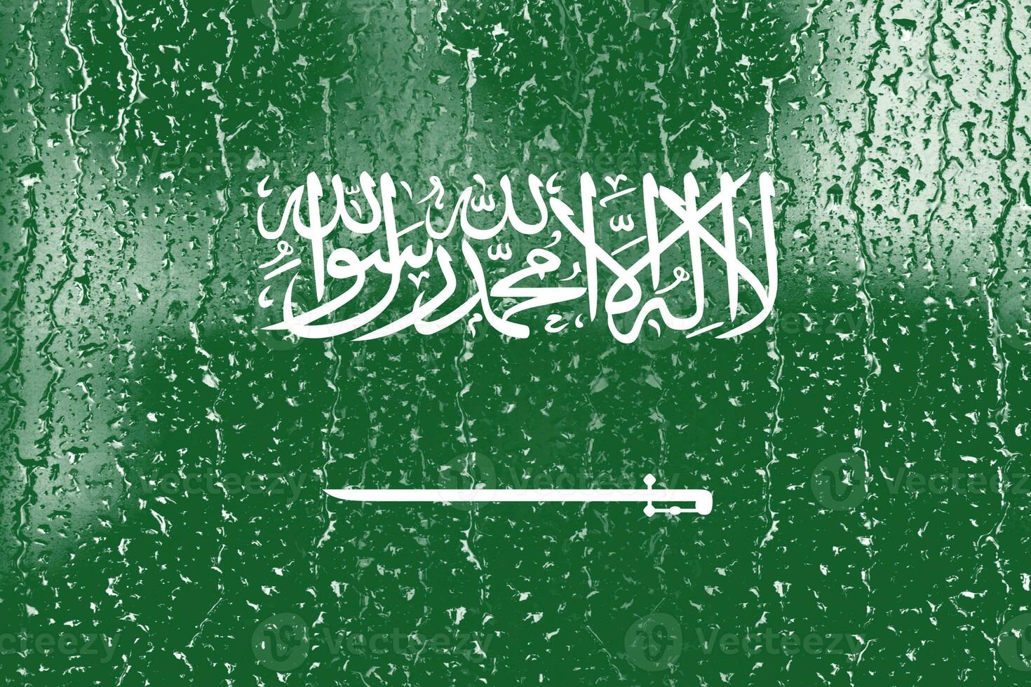 3D Flag of Saudi Arabia on a glass with water drop background. photo