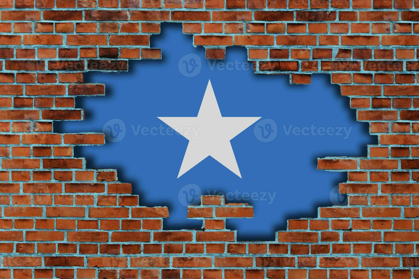 3D Flag of Somalia behind the broken old stone wall background. photo