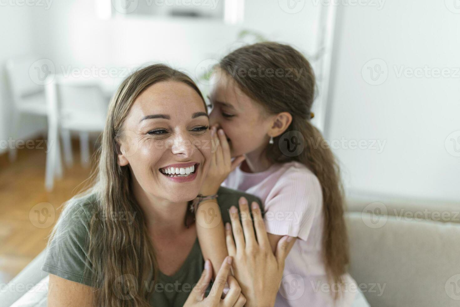 Close up image amazed mother hears incredible news from little daughter, kid girl share secret telling something interesting while mom open mouth feels surprised, trust, confidant person, fun concept photo