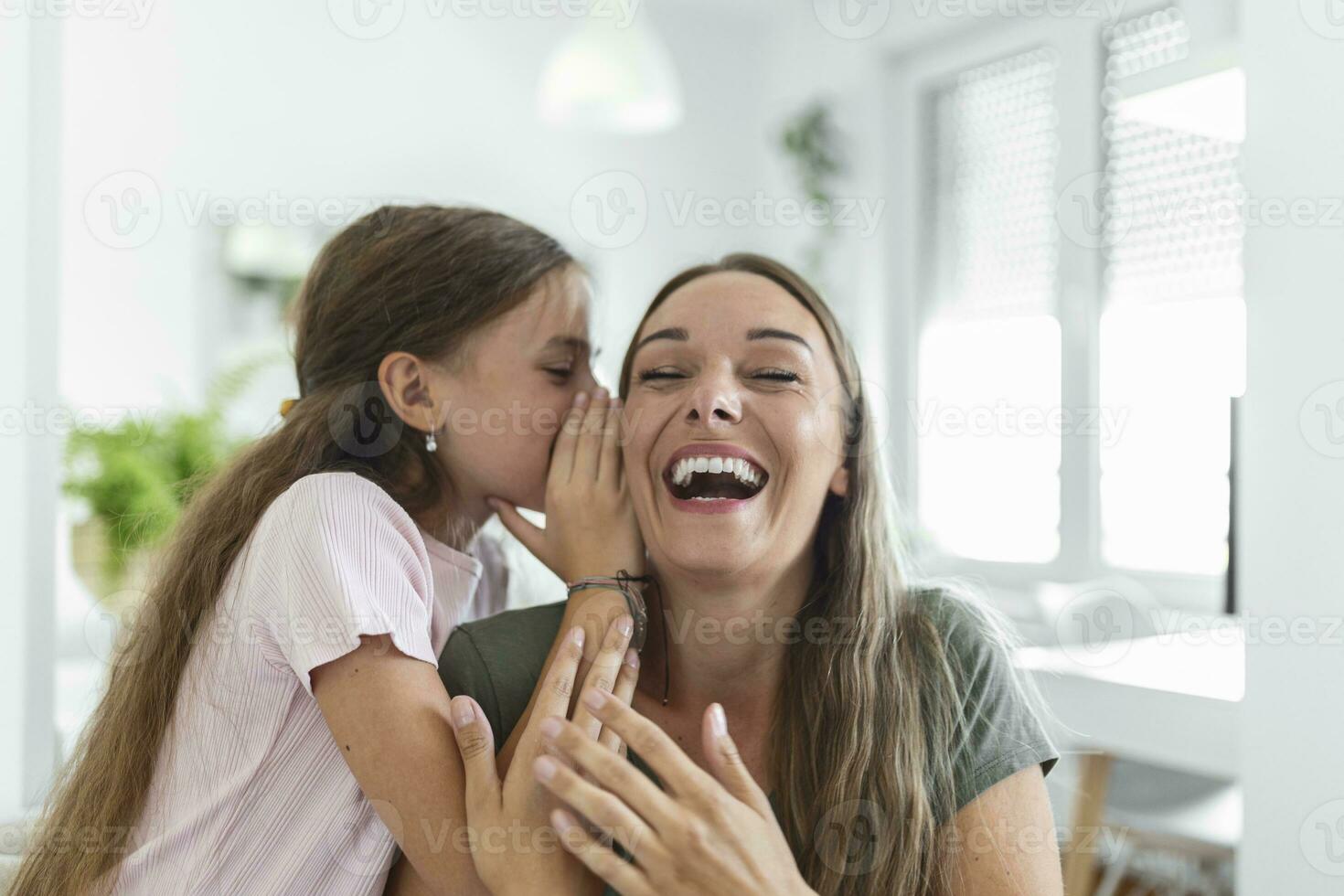 Close up image amazed mother hears incredible news from little daughter, kid girl share secret telling something interesting while mom open mouth feels surprised, trust, confidant person, fun concept photo