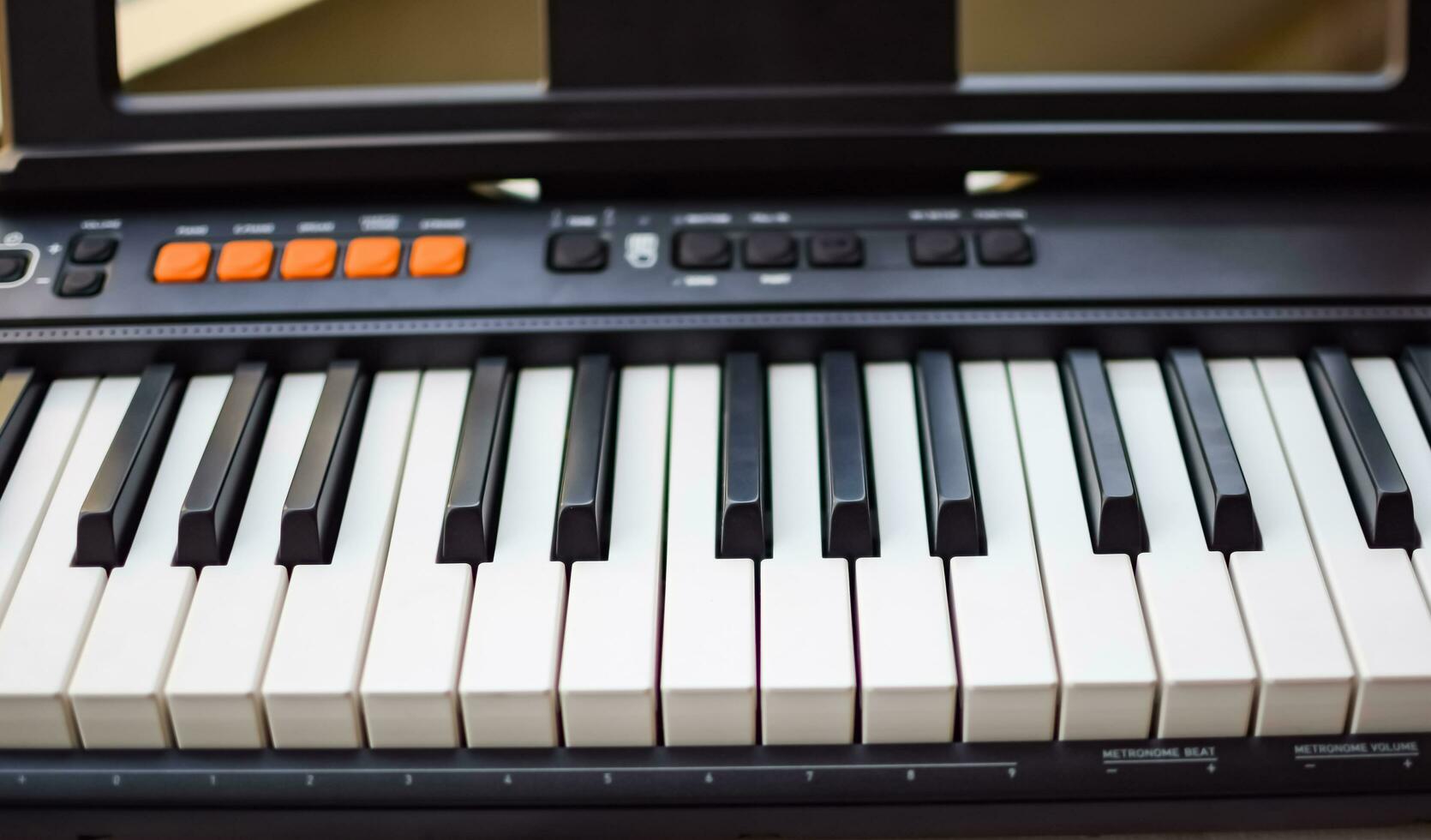 Close-up of piano keys. Piano black and white keys and Piano keyboard musical instrument placed at the home balcony during sunny day. photo