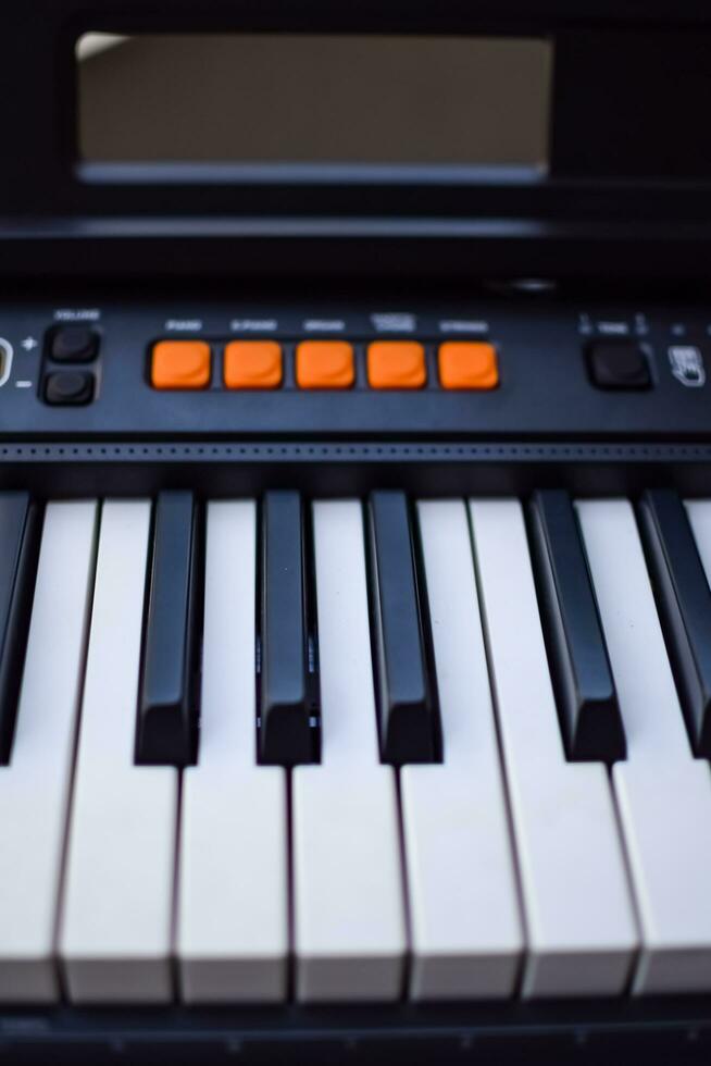 Close-up of piano keys. Piano black and white keys and Piano keyboard musical instrument placed at the home balcony during sunny day. photo