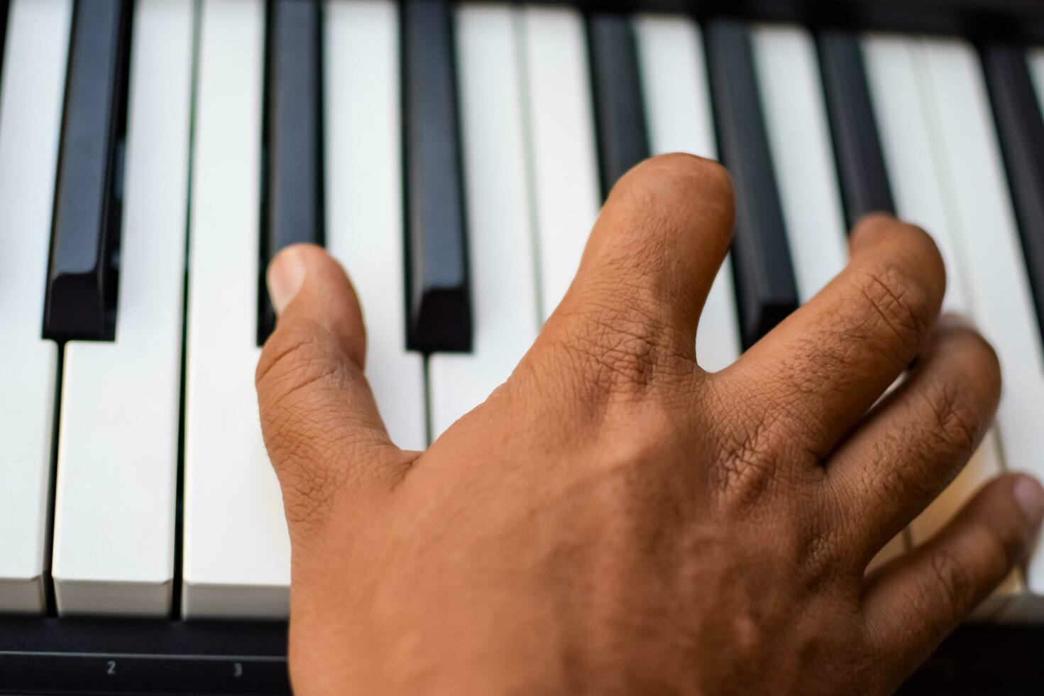 Close-up of piano keys. Piano black and white keys and Piano keyboard musical instrument placed at the home balcony during sunny day. photo