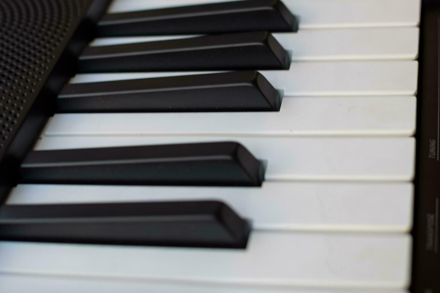 Close-up of piano keys. Piano black and white keys and Piano keyboard musical instrument placed at the home balcony during sunny day. photo