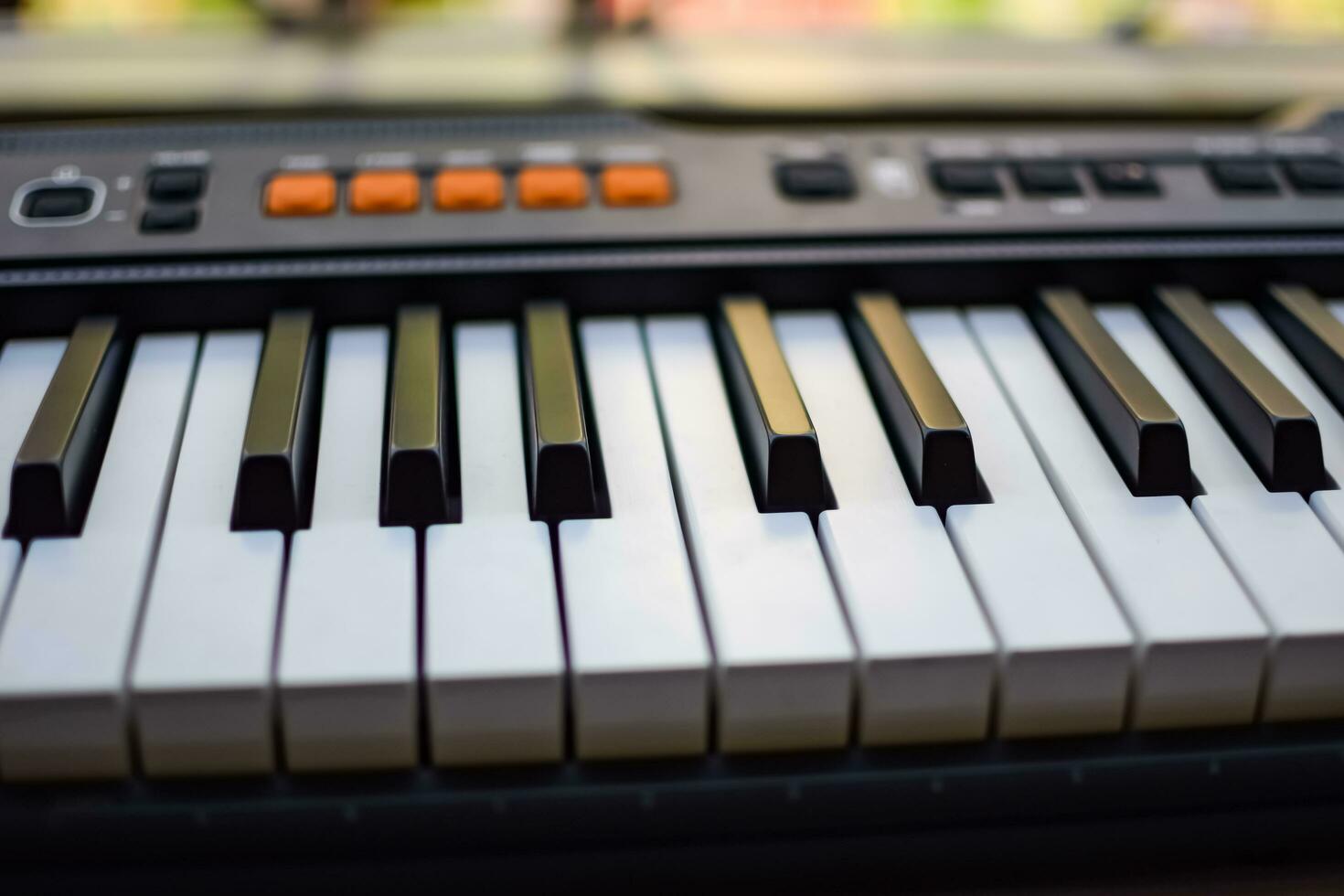 Close-up of piano keys. Piano black and white keys and Piano keyboard musical instrument placed at the home balcony during sunny day. photo