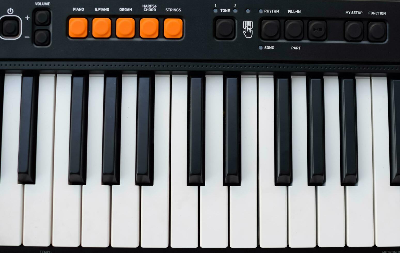 Close-up of piano keys. Piano black and white keys and Piano keyboard musical instrument placed at the home balcony during sunny day. photo