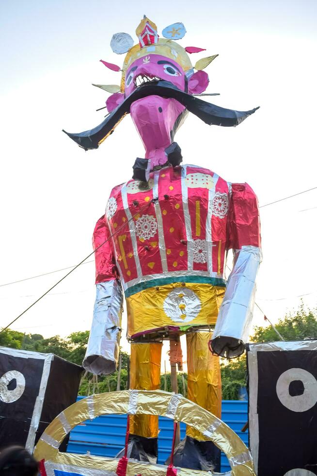 Ravnans being ignited during Dussera festival at ramleela ground in Delhi, India, Big statue of Ravana to get fire during the Fair of Dussera to celebrate the victory of truth by Lord Rama photo