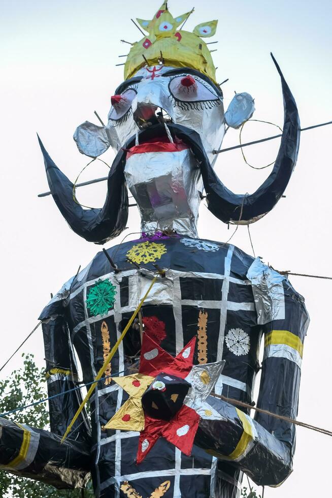 Ravnans being ignited during Dussera festival at ramleela ground in Delhi, India, Big statue of Ravana to get fire during the Fair of Dussera to celebrate the victory of truth by Lord Rama photo
