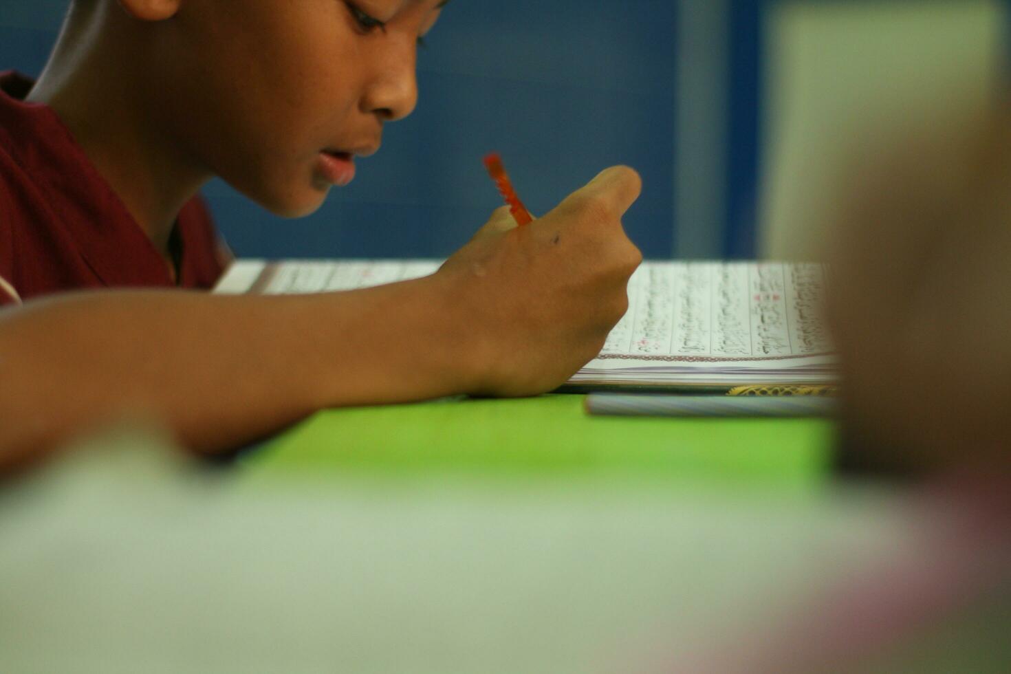 Magelang, Indonesia.07.10.2023-An Islamic Children Learning Islamic Knowledge Mengaji In The Mosque. photo