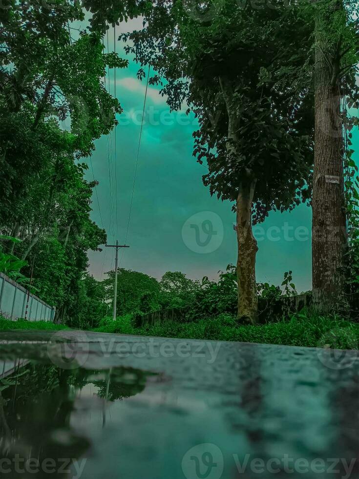 Heavy rain drop at the road surface with background. photo