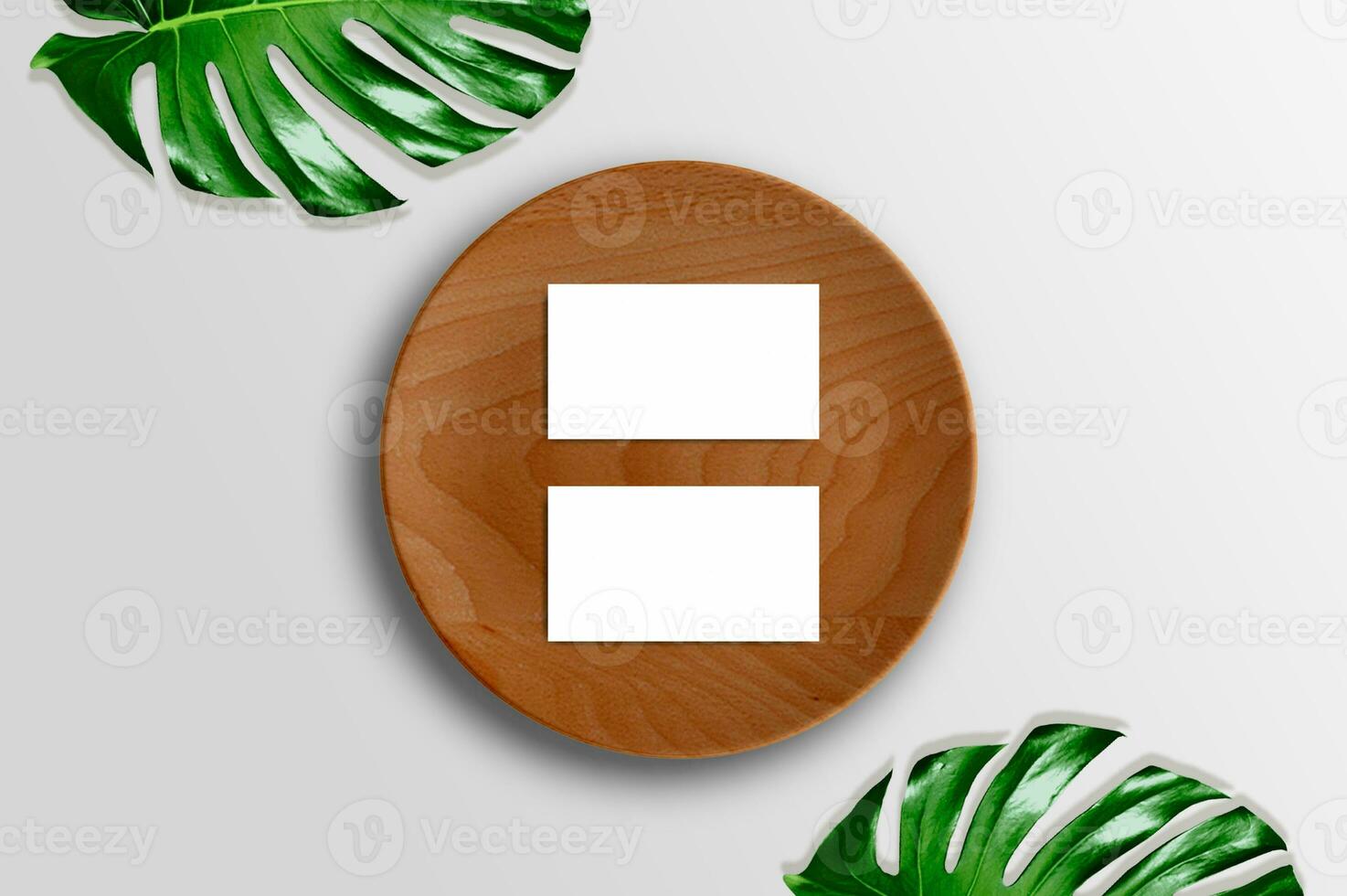Blank white business cards mockups, wooden plate, aralia and monstera leaf isolated on white table backgound. Modern template for branding identity. Tropical design. photo