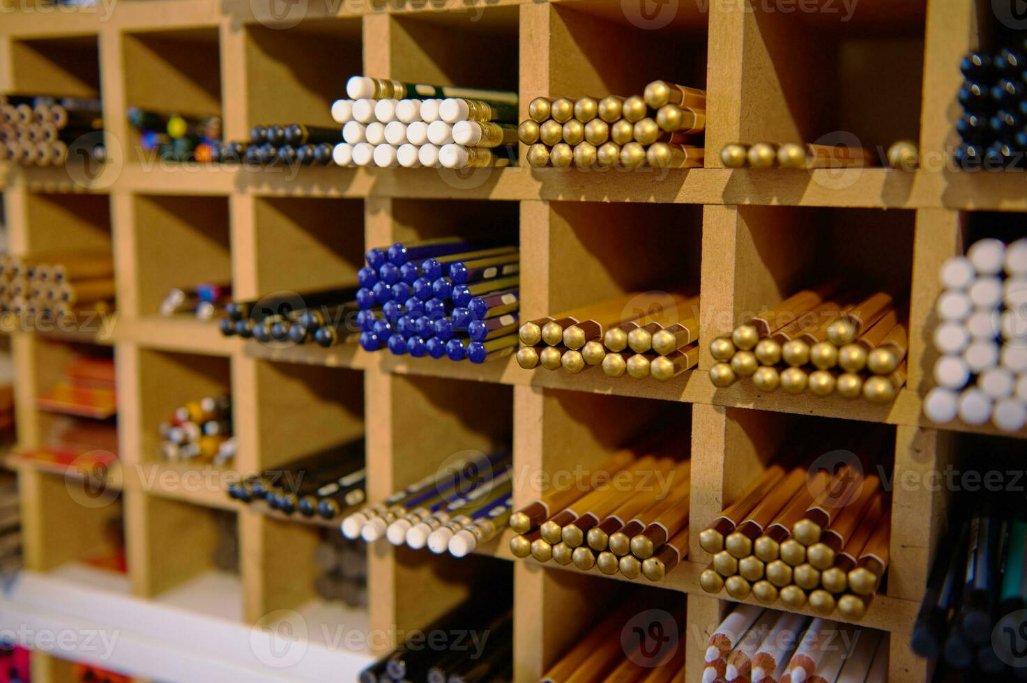 Close-up shot. A large assortment of various graphite pencils in different softness for sale in school stationery store photo