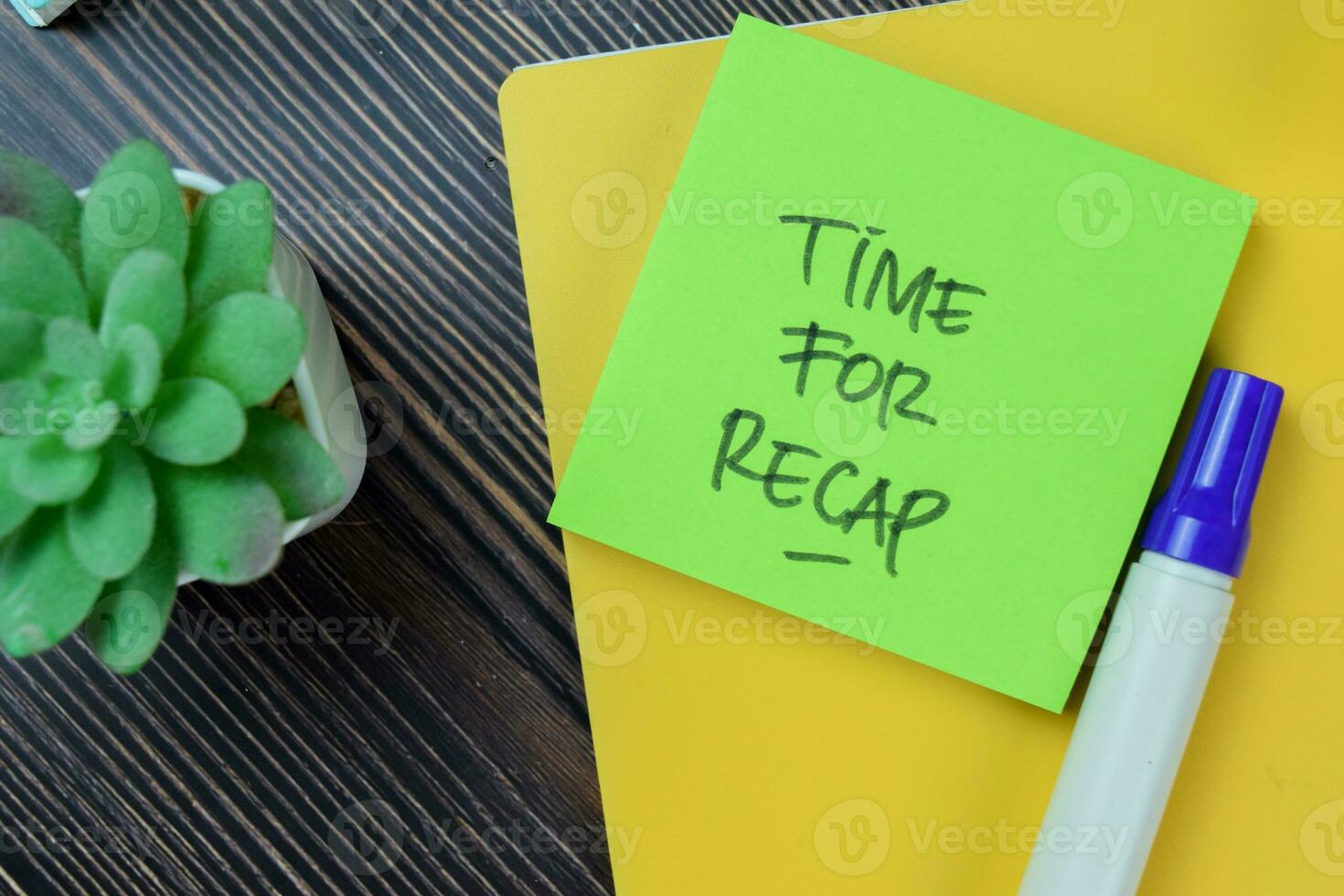 Concept of Time For Recap write on sticky notes isolated on Wooden Table. photo