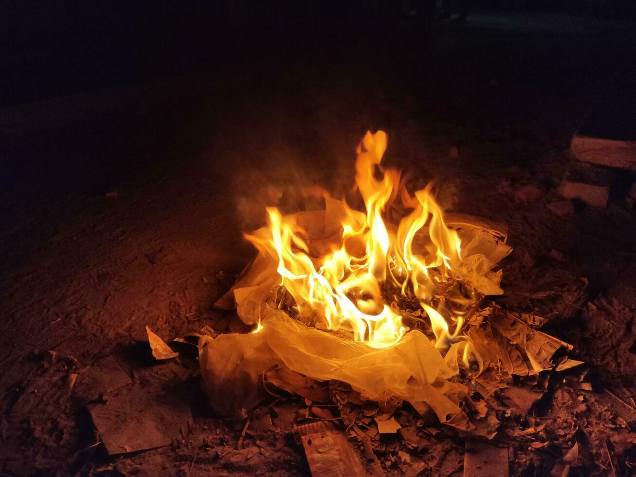 Burning Fire on garbage, Burning waste in an open area photo