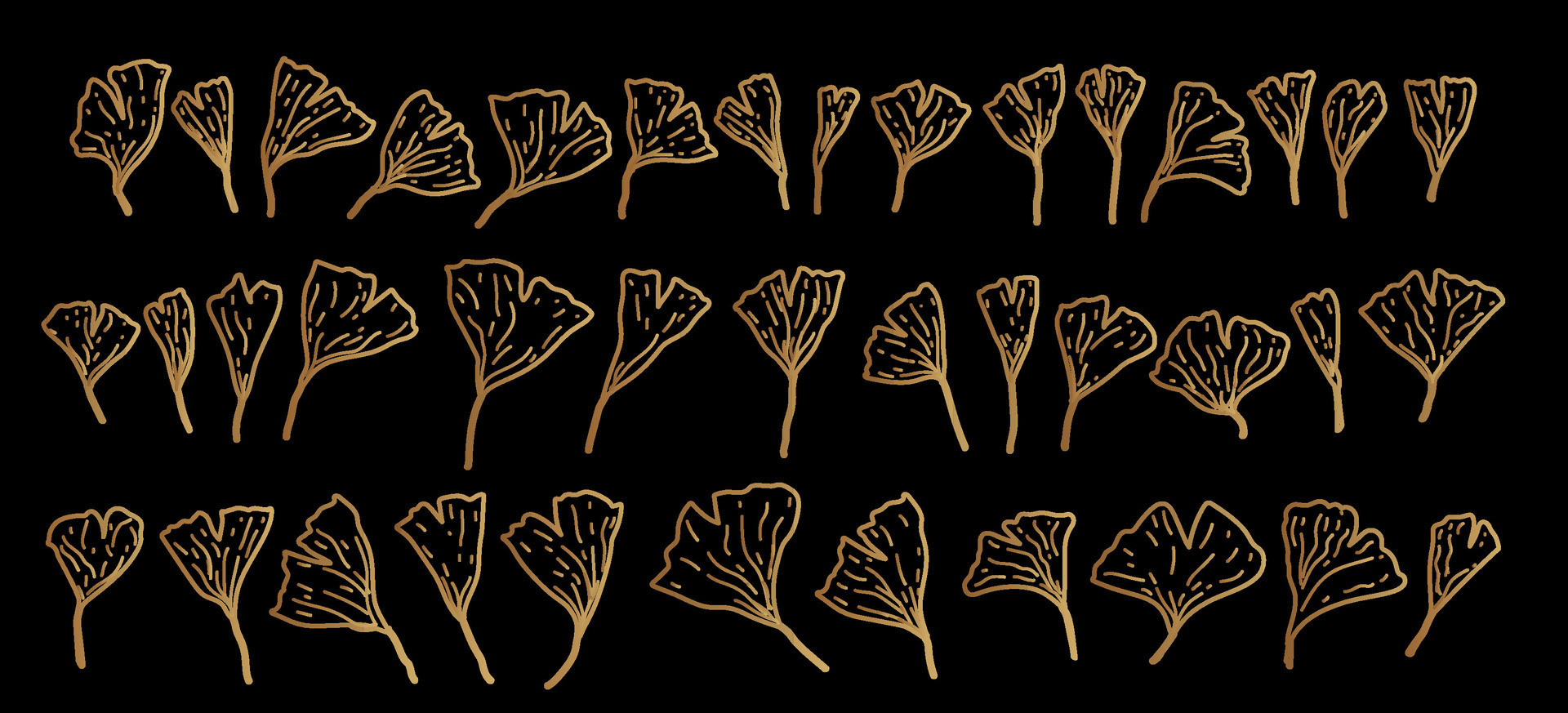 Set of gold, jewelry, shiny Ginkgo Biloba leaves on black background
