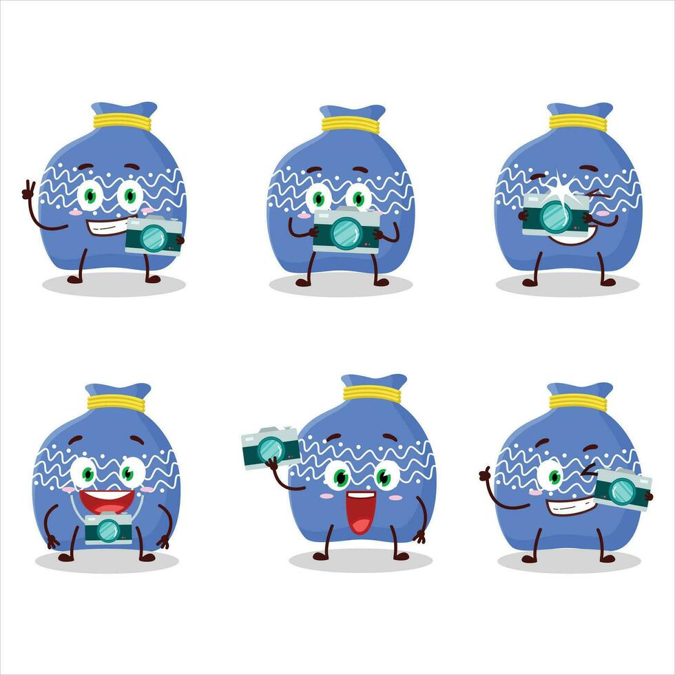 Photographer profession emoticon with blue santa bag cartoon character vector