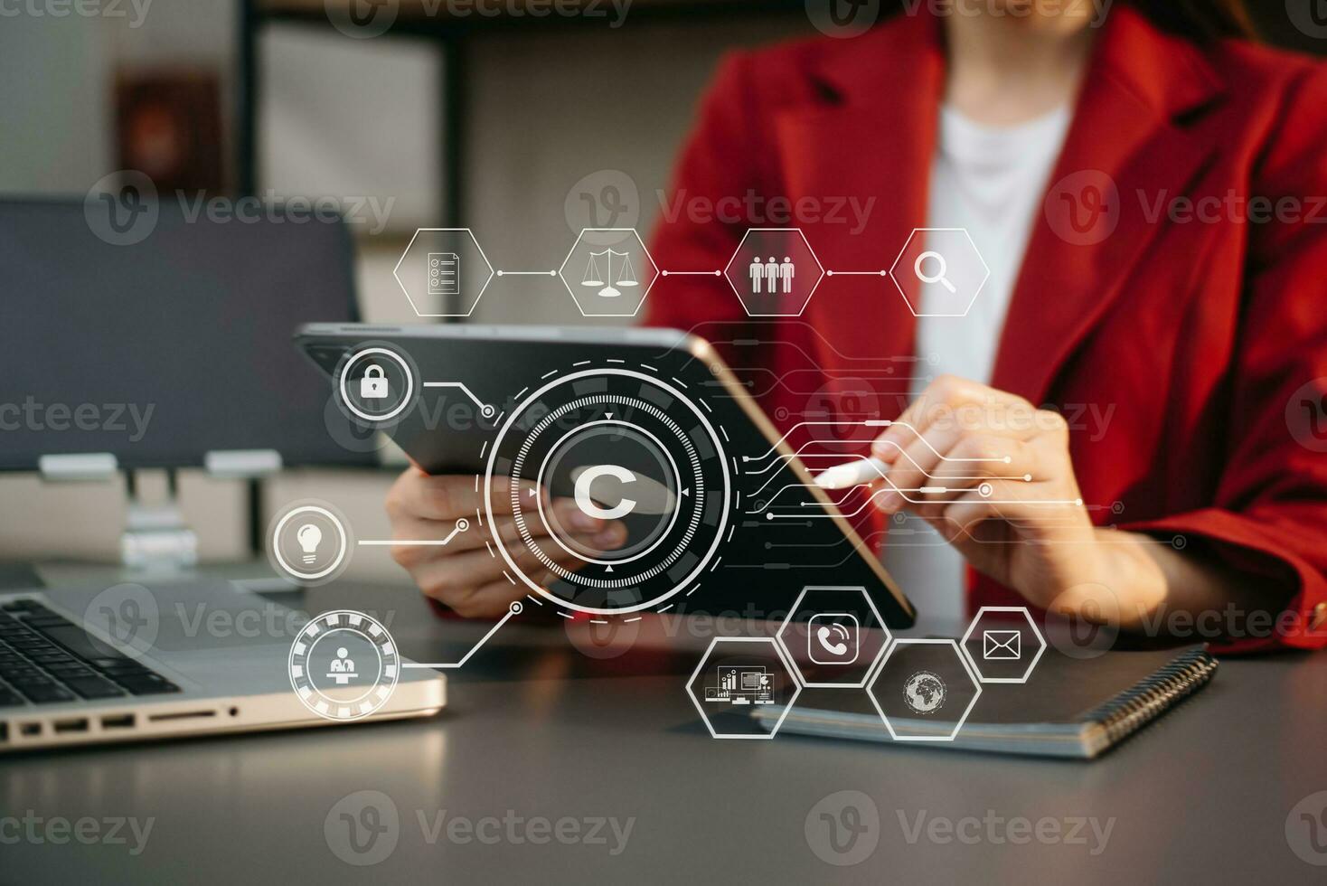 Copyright or patent concept, Person hand using laptop computer, tablet and smartphone with virtual screen copyright icon trademark, Creation ownership against piracy. photo