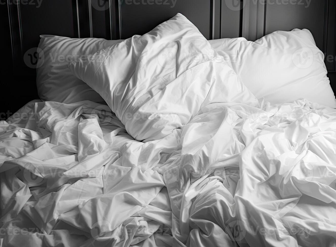 Top view of unmade bedding sheets and pillow ,Unmade messy bed after comfortable sleep concept created with technology. photo