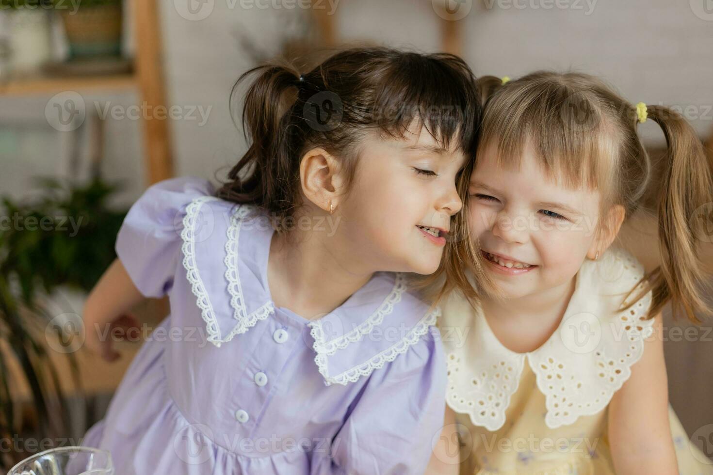 little happy girls fool around in the spring and cook in the kitchen photo