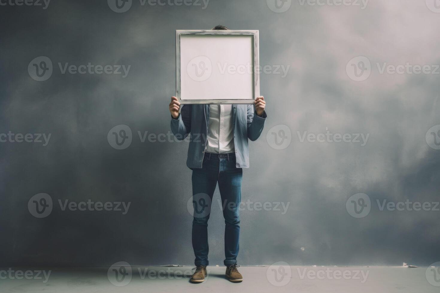 Full body portrait of man hold blank picture frame on grey color background. Generative AI photo